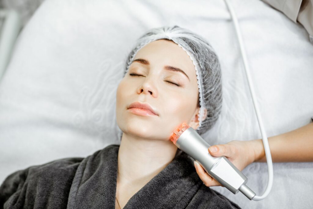 Woman During The Facial Treatment At The Beauty Salon